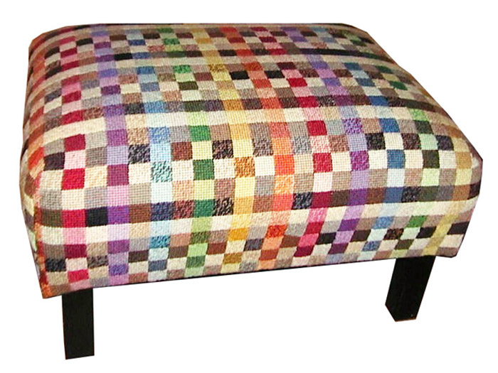 A big footstool recycled into a work of art